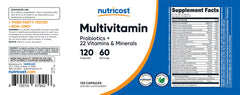 Nutricost frasco sobre mesa con frutas y libro, estilo de vida sano