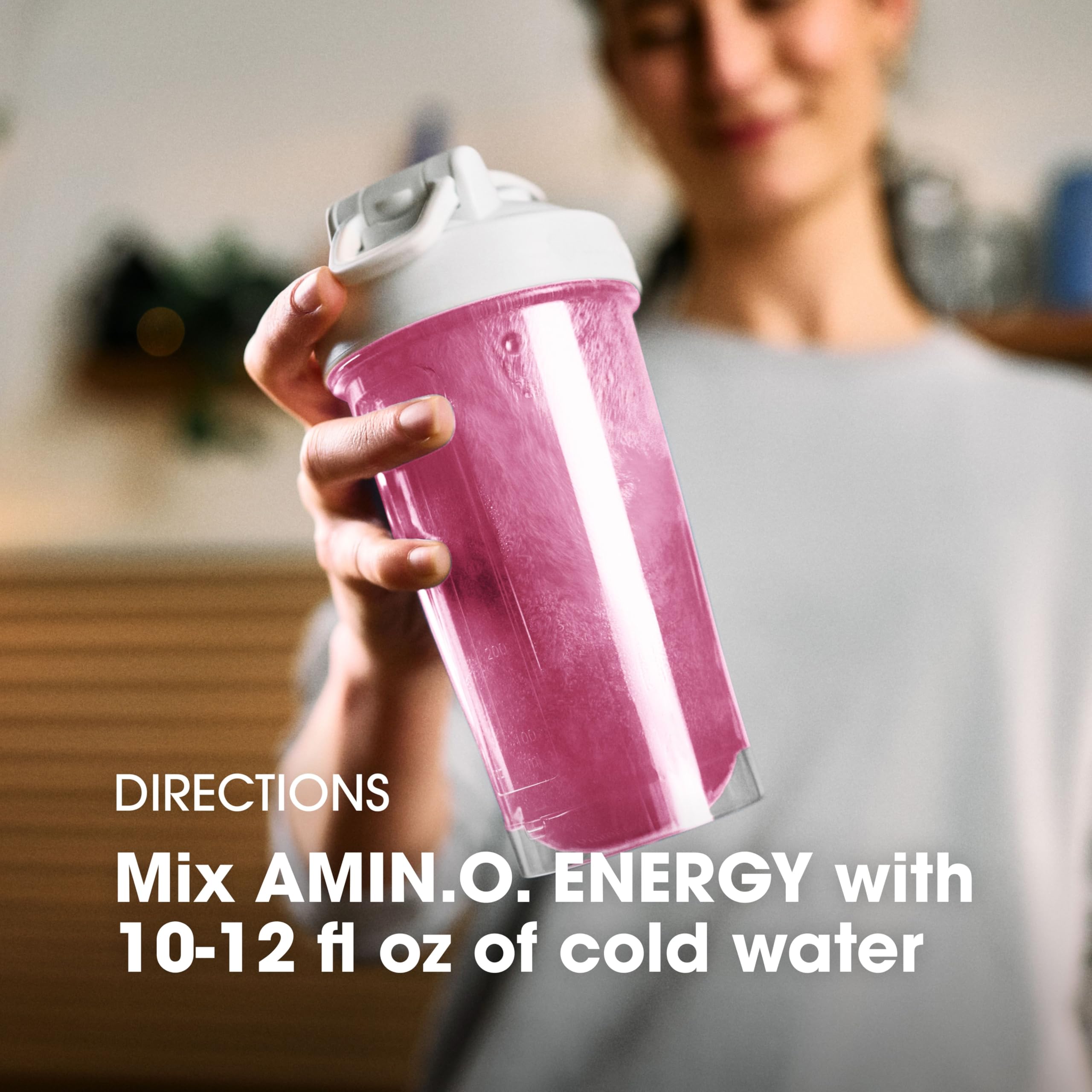 Optimum Nutrition sobre junto a llave y teléfono para comparar tamaño y portabilidad