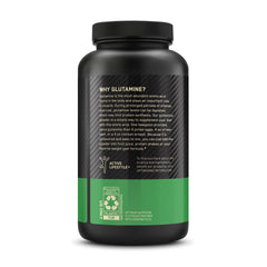 Optimum Nutrition producto junto a pesas en ambiente de entrenamiento