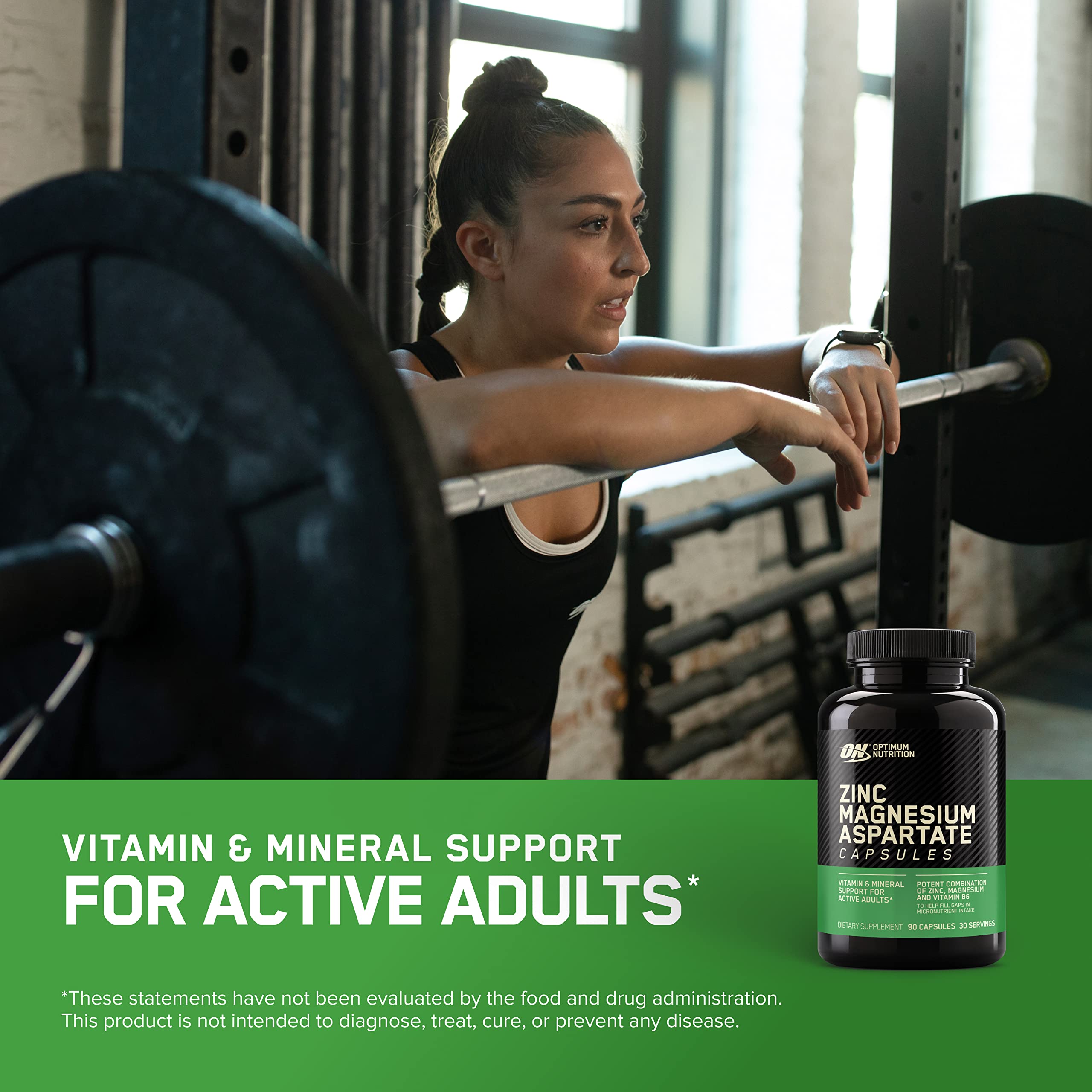 Optimum Nutrition tabletas en mano para apreciar tamaño y dosificación