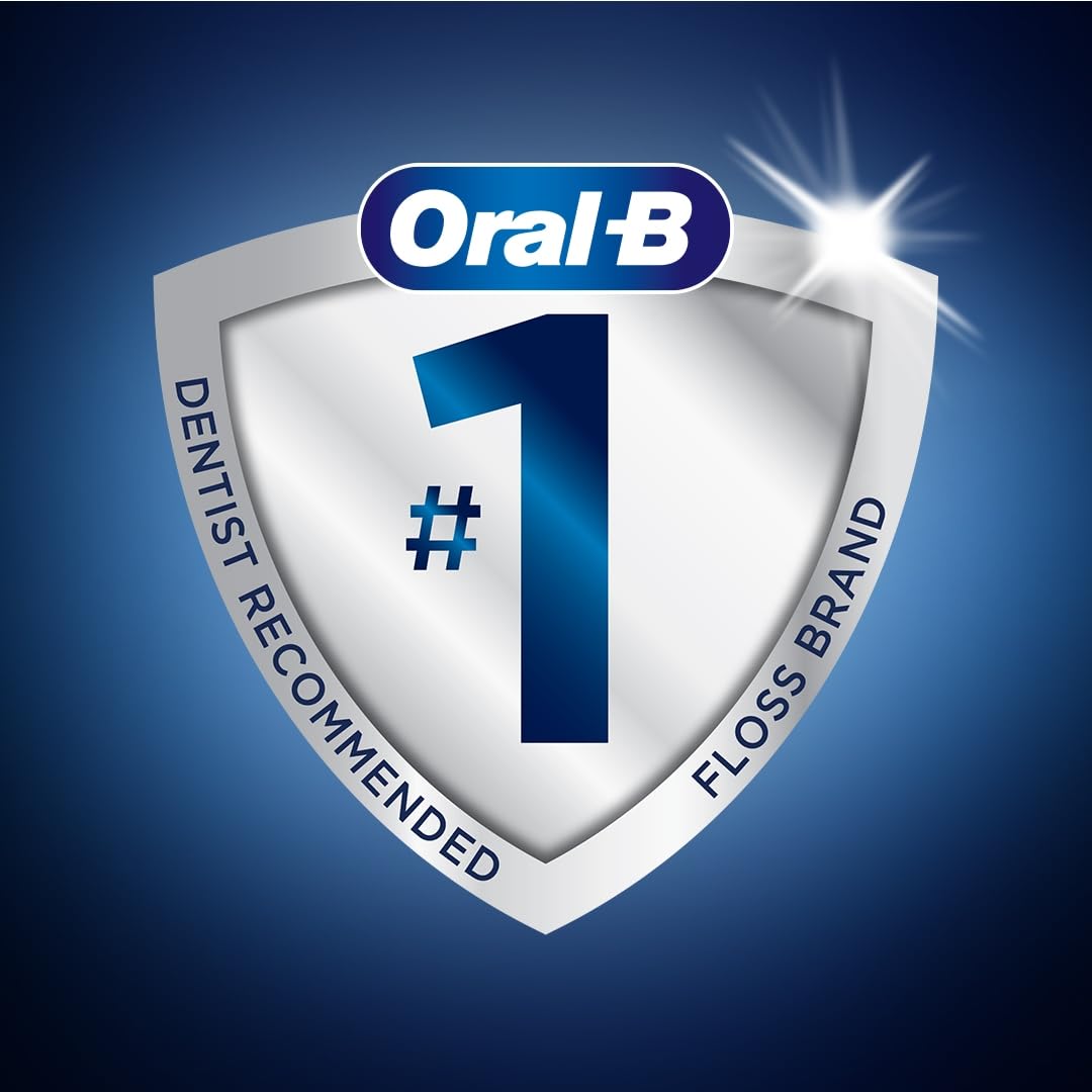 Oral-B floss picks en un baño moderno mostrando uso cotidiano y frescura inmediata