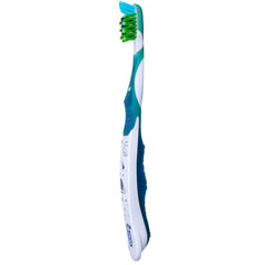 Oral-B comparativa de tamaño del cabezal frente a moneda para escala