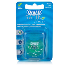 Oral-B cinta dental en uso entre dientes, limpieza efectiva y sensación fresca