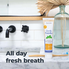 Oxyfresh tubo junto a regla para comparar tamaño y duración