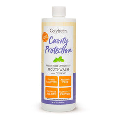 Oxyfresh botella frontal mostrando embalaje y beneficios para protección anticaries