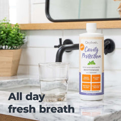 Oxyfresh junto a una regla mostrando tamaño de 473 ml para durabilidad