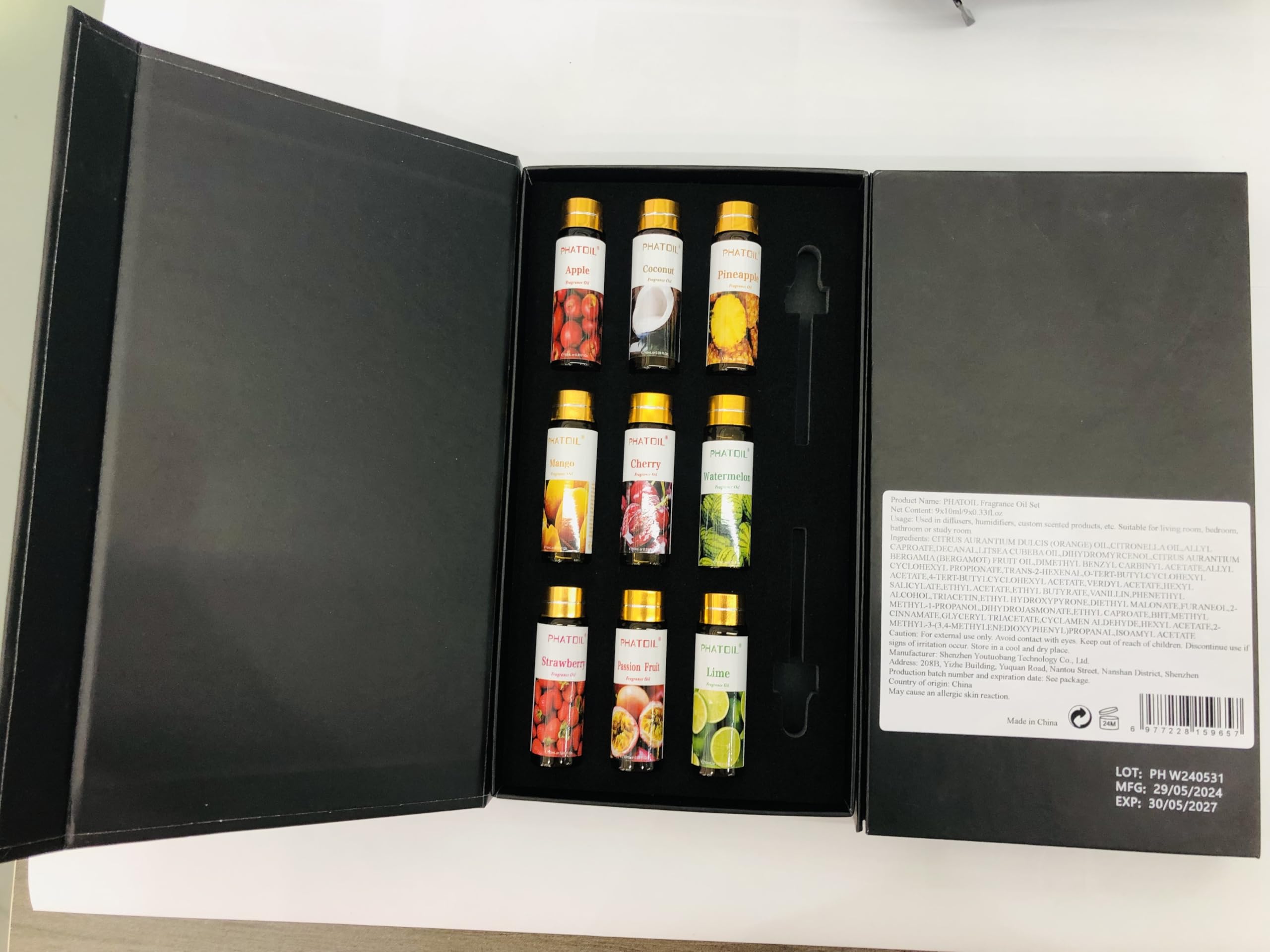 PHATOIL caja regalo abierta con frascos dentro indicando presentación cuidada