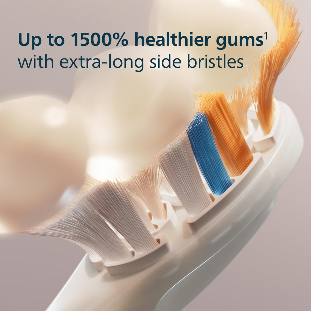Philips Sonicare cabezal junto a un diente modelo para mostrar escala y cobertura