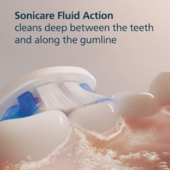Philips Sonicare comparación de tamaño junto a un cepillo manual que muestra cobertura superior