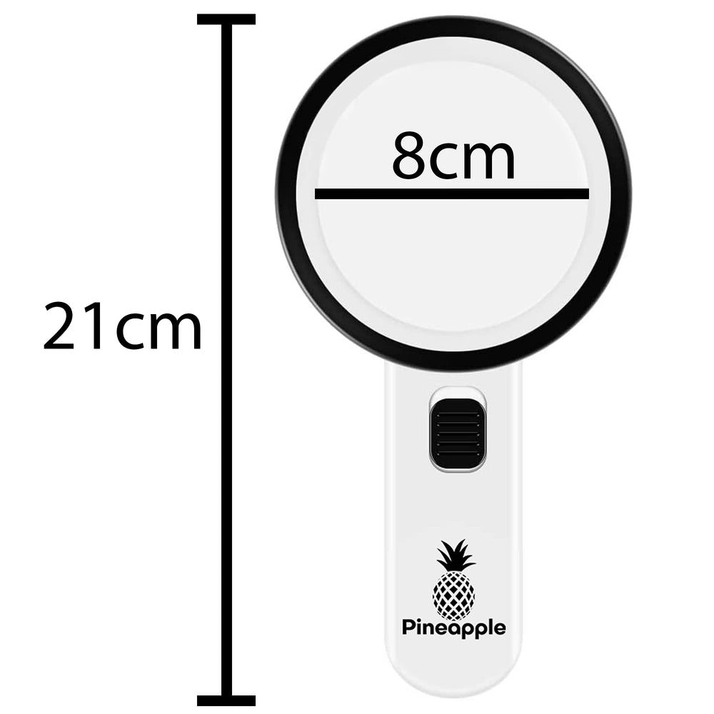 Pineapple lupa junto a una mano para comparar tamaño, portátil