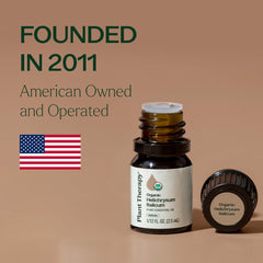 Plant Therapy frasco 2,5 mL junto a moneda, muestra tamaño compacto