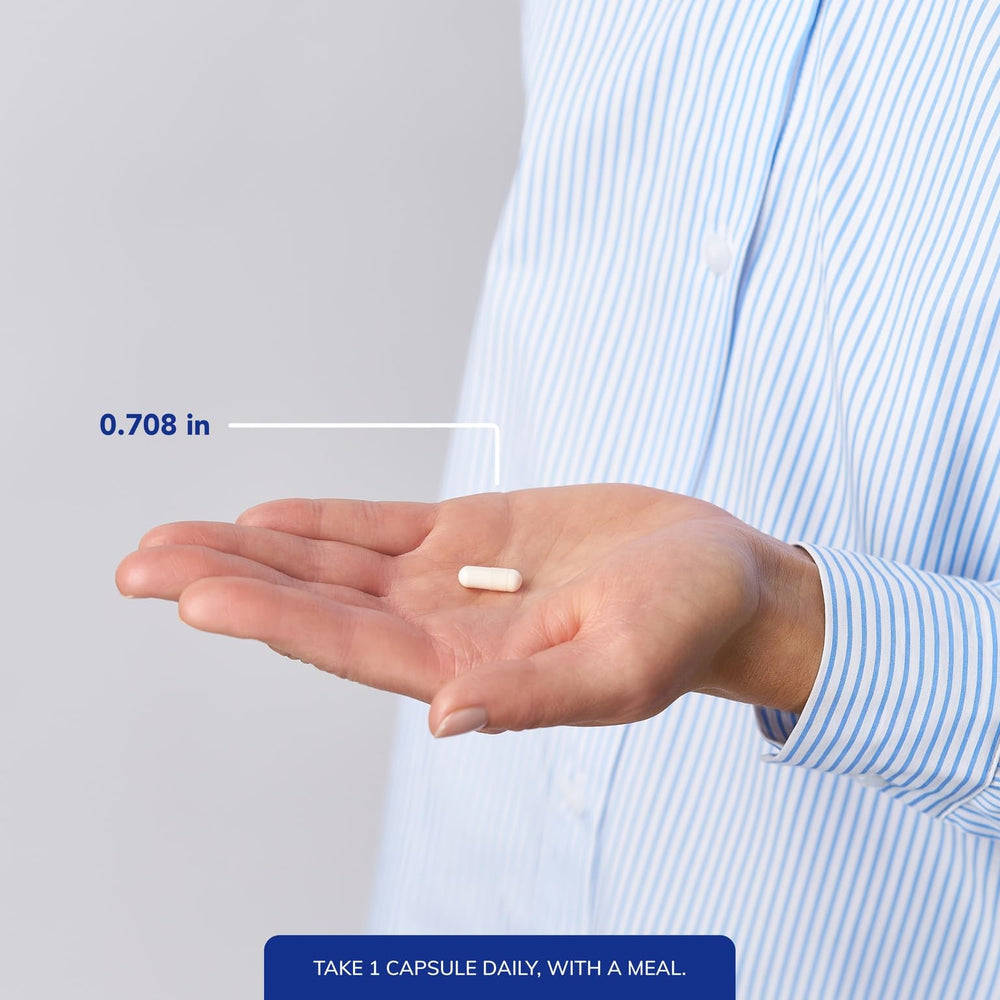Pure Encapsulations cápsula junto a moneda para comparar tamaño y dosis práctica