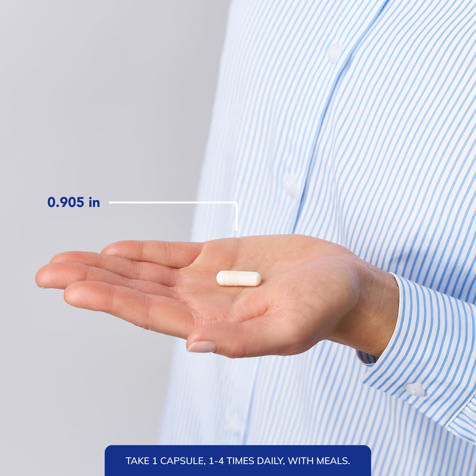 Pure Encapsulations cápsula junto a moneda para comparar tamaño y facilidad de uso