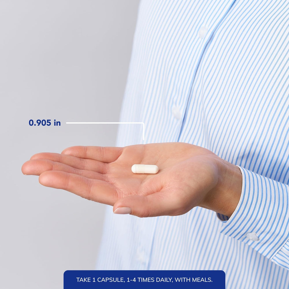 Pure Encapsulations cápsula junto a moneda para comparar tamaño y facilidad de uso
