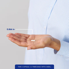 Pure Encapsulations cápsula junto a regla para referencia de tamaño
