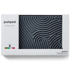Manos de niños usando Pushpeel XL para mejorar motricidad y concentración