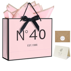 QLSKO frente de la bolsa de regalo mostrando diseño y asas, presentación lista para regalo