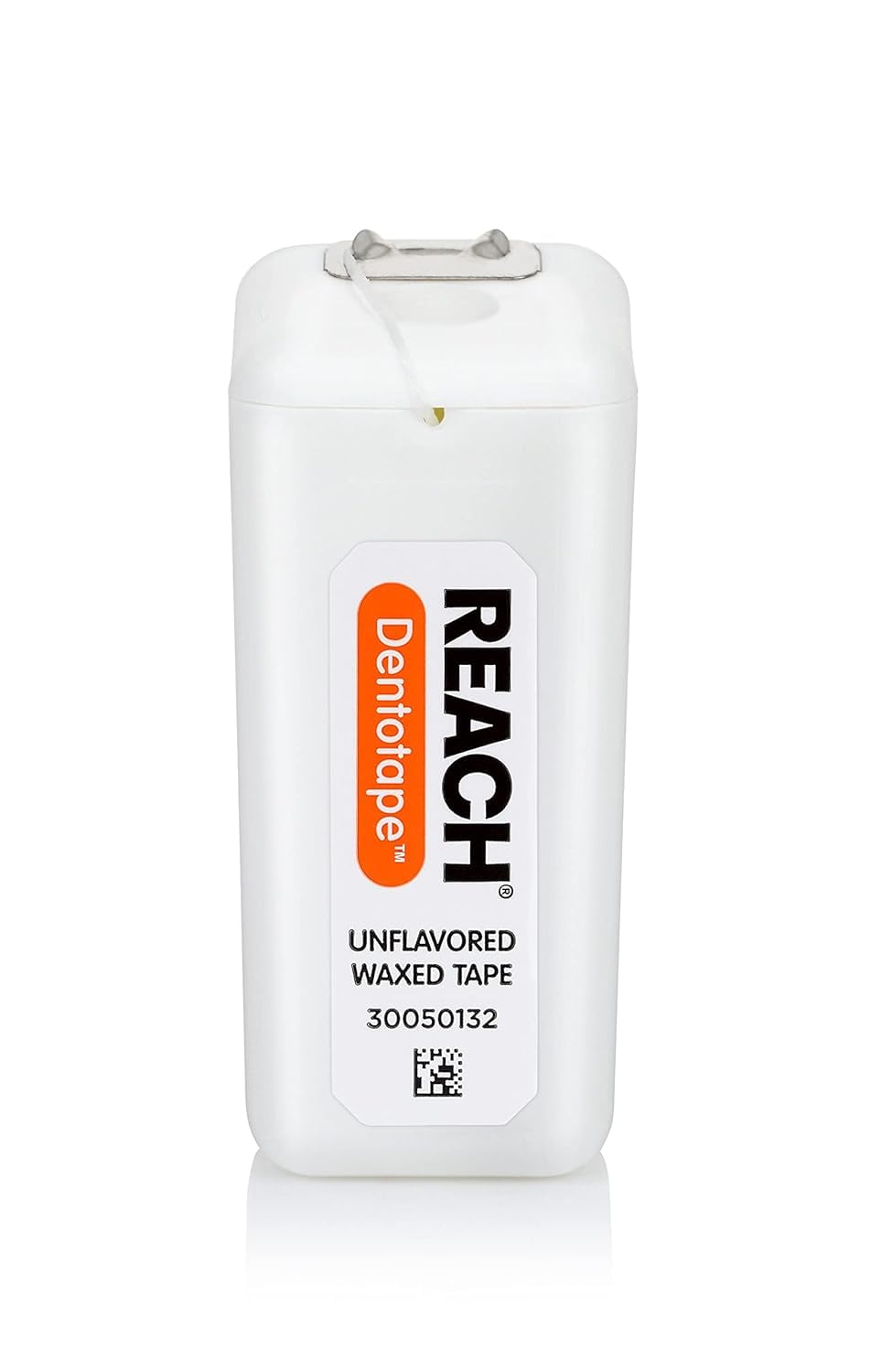 Comparación de tamaño de Reach Dentotape junto a una regla para referencia