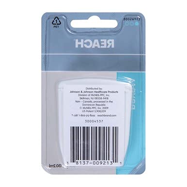 Hilo Reach deslizado entre dientes mostrando limpieza eficaz de encías