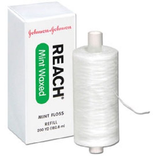 Reach Johnson & Johnson envase frontal mostrando carrete 200 yardas y beneficio de larga duración