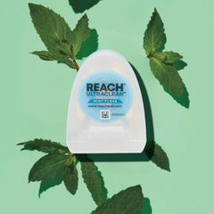 Reach hilo deslizando entre dientes demostrando resistencia