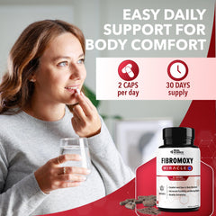 Real Science Fibromoxy cápsula junto a moneda para comparar tamaño
