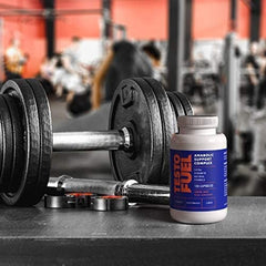 ROAR AMBITION TestoFuel en cocina con vaso de agua, listo para consumo diario