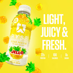 RYSE botella junto a piñas para destacar sabor tropical y perfil bajo en calorías