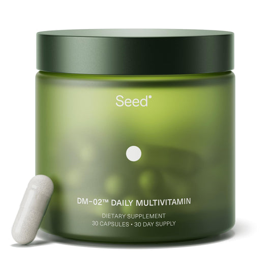 Seed DM-02 frasco frontal mostrando etiqueta clara y beneficios