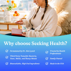 Seeking Health cápsulas junto a una regla para comparación de tamaño práctica