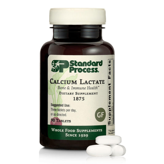 Standard Process envase frontal mostrando calcio lactato vegano y beneficios