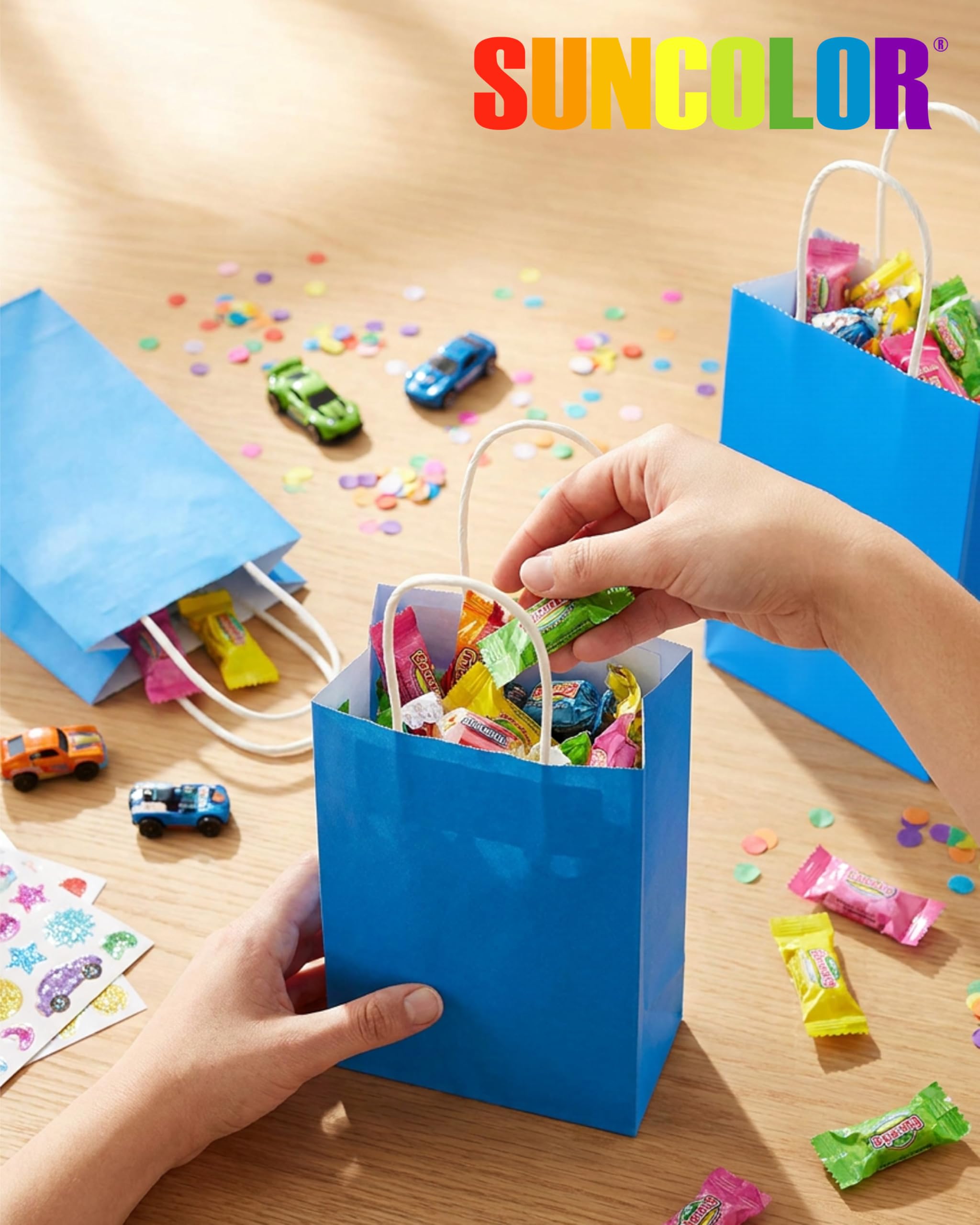 SUNCOLOR conjunto de 24 bolsas azules dispuesto en mesa para fiesta