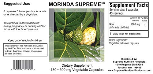 Supreme Nutrition primer plano de cápsulas de Noni mostrando textura y pureza del producto