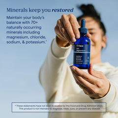 Trace Minerals frasco junto a una regla para comparar tamaño y capacidad 4 fl oz