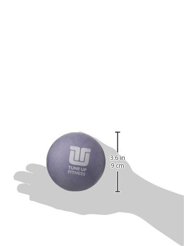 Tune Up Fitness Alpha Ball en uso bajo la espalda alivia tensión lumbar