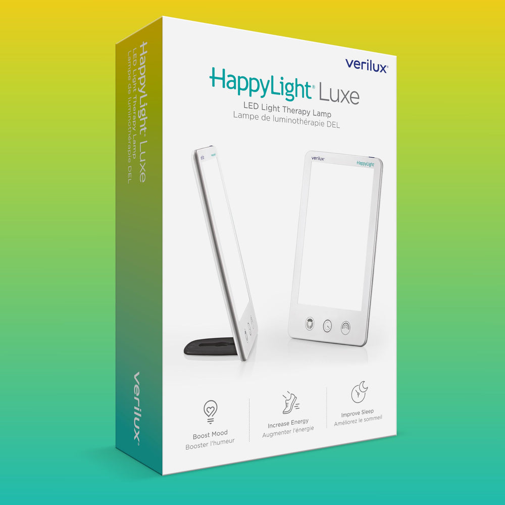 Comparación de tamaño Verilux con libro mostrando portabilidad