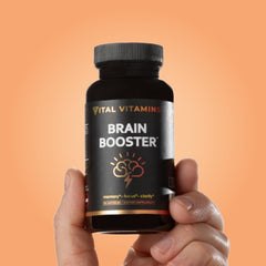 Vital Vitamins envase en mesa de trabajo promoviendo productividad