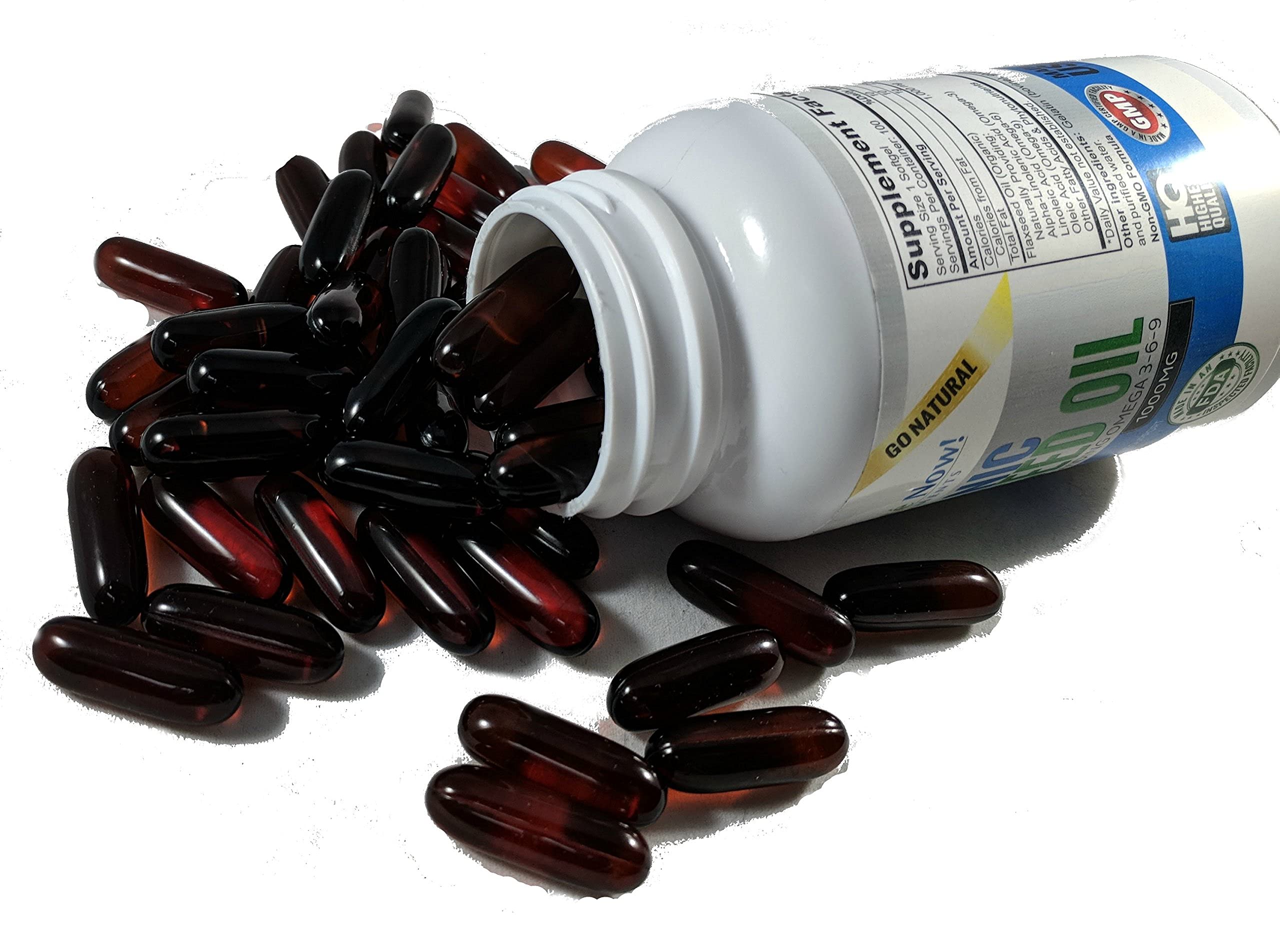 Vitalité Now! cápsula junto a una regla para comparar tamaño y cantidad