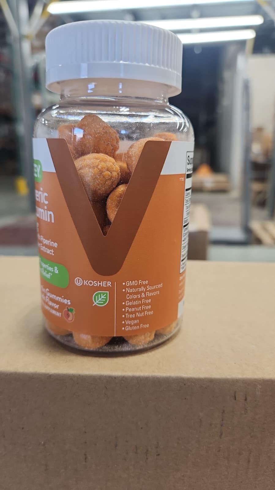 Viteey frasco abierto con gomitas visibles destacando cantidad interior