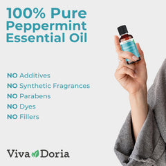 Viva Doria gota de aceite sobre hoja de menta que revela textura pura y aspecto cristalino