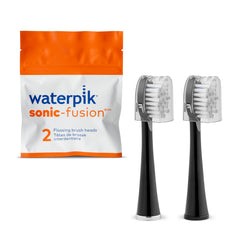 Waterpik cabezal frontal en paquete mostrando color negro y beneficio de recambio fácil