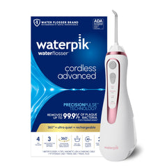 Waterpik frontal color rosa oro mostrando diseño compacto y botón de encendido, facilita higiene diaria