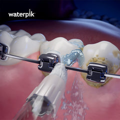 Waterpik comparación de tamaño de puntas junto a un cepillo, fácil identificación