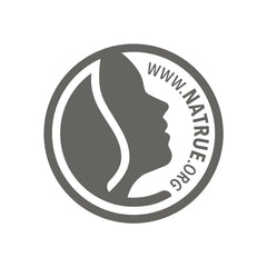 Weleda aceites vegetales en primer plano que nutren y suavizan la piel