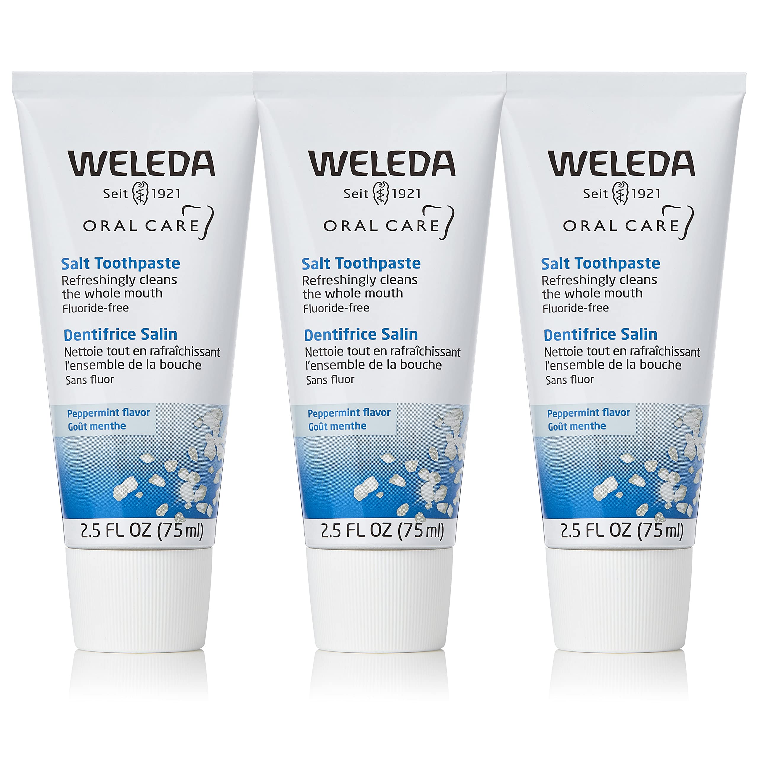 Weleda pasta dental con sal frente del empaque mostrando pack de tres, limpieza natural