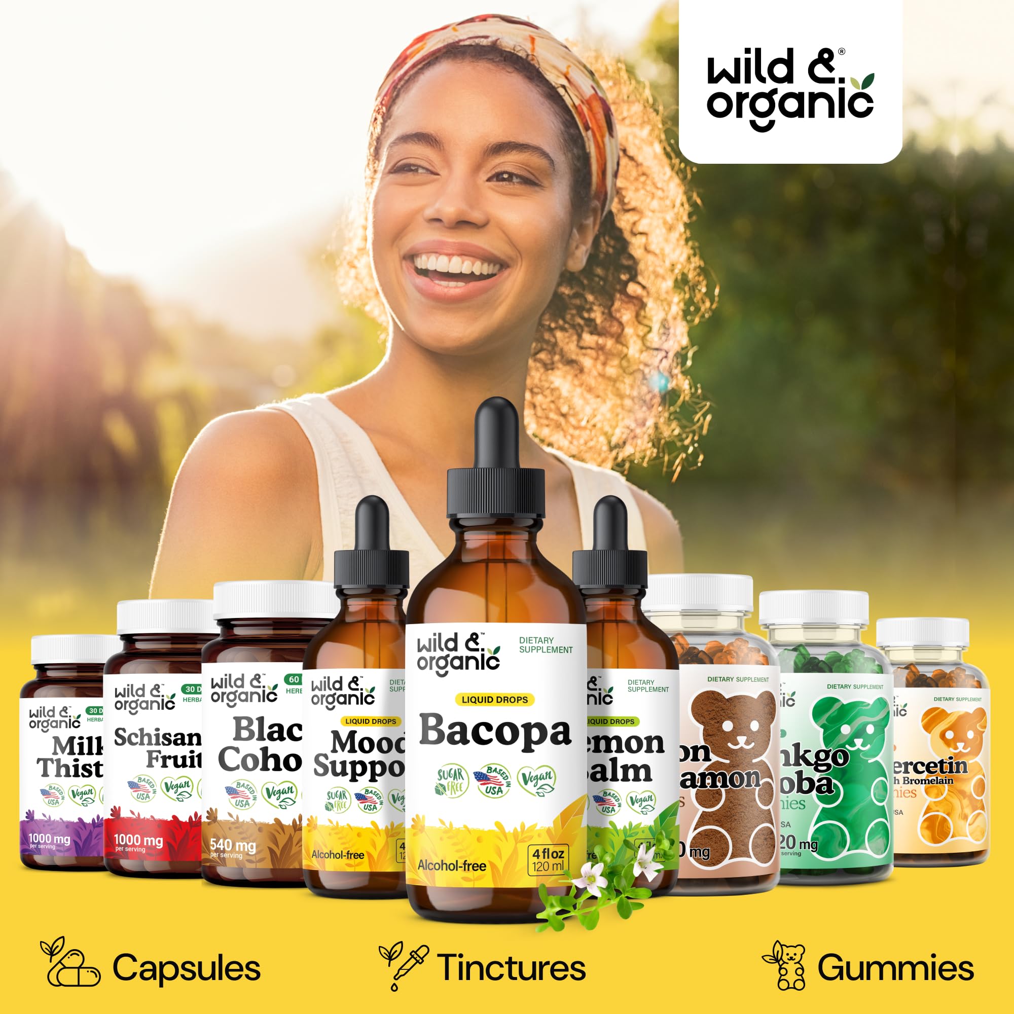Wild & Organic botella junto a mano para referencia de tamaño y portabilidad