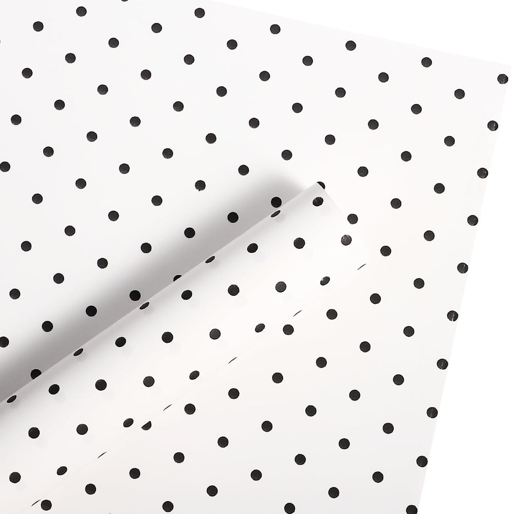 WRAPAHOLIC ramo envuelto con papel lunares mostrando acabado profesional