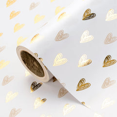 WRAPAHOLIC rollo frontal mostrando corazones dorados y acabado elegante