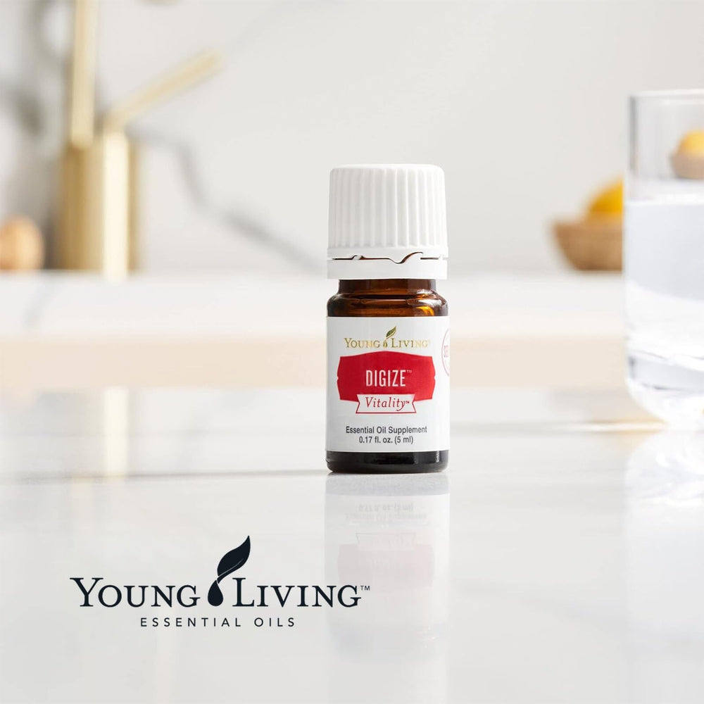 Young Living DiGize junto a objetos comunes para escala, práctico y portátil