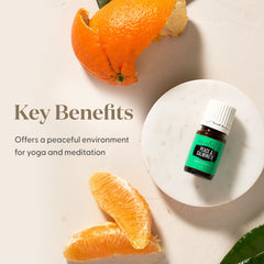 Young Living frasco junto a llave y móvil para comparar tamaño portable
